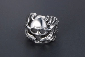 Detailed view of retro gothic wing skull ring with intricate silver-tone 3D relief carving
