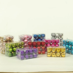 Assorted colorful Christmas balls in transparent boxes with matte and glitter finishes
