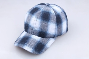 Close-up of blue and grey plaid cotton baseball cap with textured wool-like fabric finish