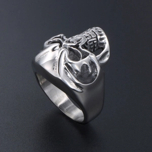 Gothic skull ring for men in polished silver stainless steel on a black background