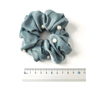 Velvet hair scrunchie in blue with white pearls and gold trim, 10cm diameter view