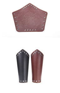 Detailed macro view of black and brown leather wristbands with metallic rivet accents