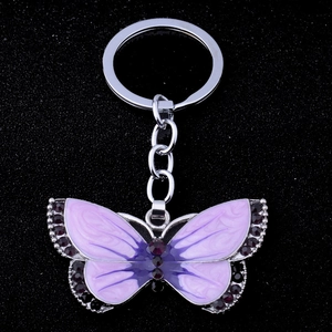 Vintage silver butterfly keychain with purple enamel finish and rhinestone accents
