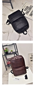 Detailed view of dual-zipper compartments and premium PU leather texture on backpack