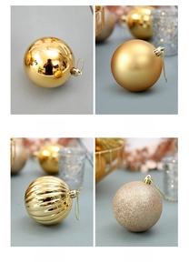 Detail of 4cm gold Christmas baubles showing shiny, matte, ribbed and glitter finishes