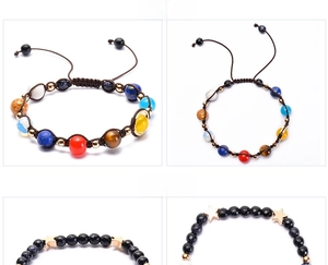 Detail view of solar system bead bracelet with agate stones and braided cord