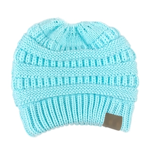 Detailed view of light blue thick-knit beanie texture with a faux leather patch detail