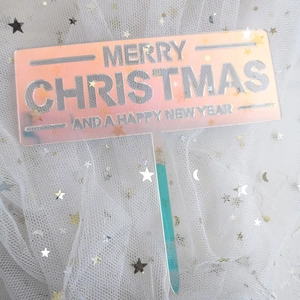 Merry Christmas acrylic cake topper in pink gradient with silver lettering for parties