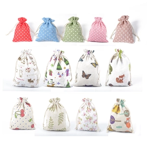 Assorted cotton linen drawstring pouches featuring colorful polka dots and animal prints
