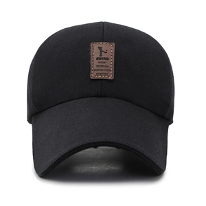 Classic black cotton baseball cap featuring a brown leather EDIKO patch on the front