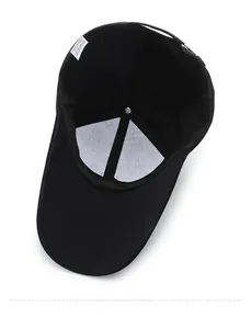 Detailed interior of black cotton baseball cap showing lining and washing label