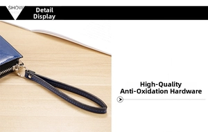 Close-up of premium anti-oxidation silver zipper and leather strap on navy blue wallet
