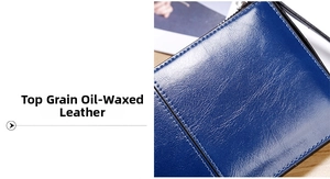 Detailed macro view of premium dark blue oil wax leather with precise stitching quality