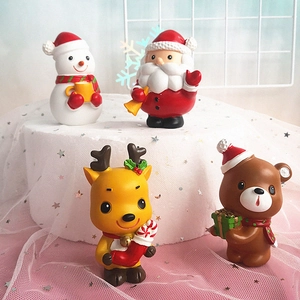 Macro detail of Christmas figurines featuring Santa, Snowman, Reindeer and Bear on a stand