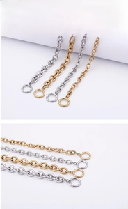 Detail of high-polished stainless steel O-chains in gold and silver with ring clasps