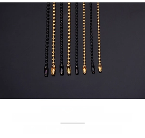 Detail of round bead stainless steel necklaces in gold and black with secure metal clasps