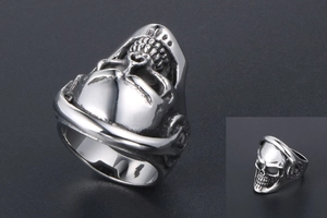 Detailed side and front views of a gothic skull ring with punk headphone design