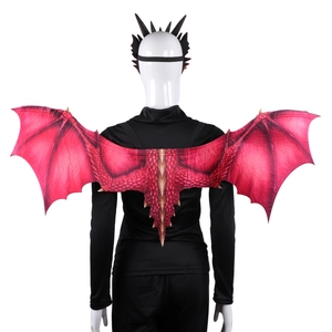 Detailed view of red dragon wings with scale print and black horn headband on a model