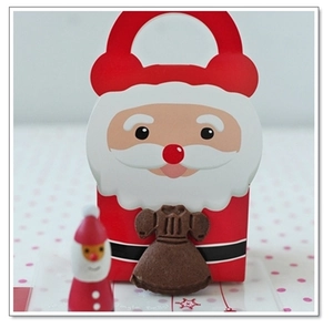 Detailed view of Santa Claus gift box with red handle and cute dress decoration accessory