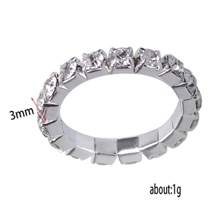 Detail shot of a 3mm wide silver eternity ring with three rows of sparkling crystals