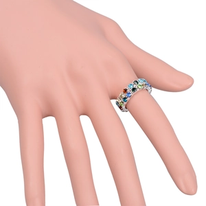 Detailed macro view of triple-row colorful crystal stretch ring on silver metal base
