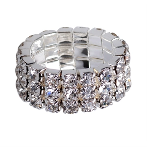 Detailed view of silver elastic ring with three rows of clear crystals for women