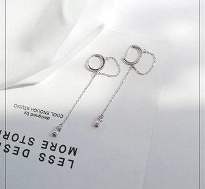 Silver drop earrings featuring long chains with square zircon pendants in a minimalist style