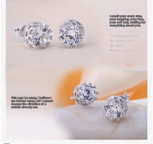 Detail of S925 silver crown earrings with cubic zirconia and heart hollow design