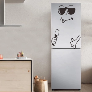 Close-up of a cool black cartoon character fridge magnet on a modern kitchen surface