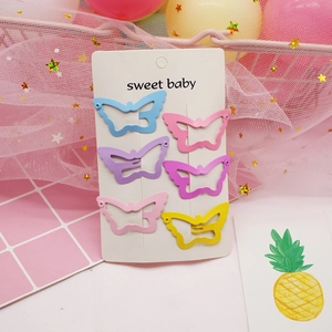 Cute set of six colorful metal butterfly hair clips for children on a display card
