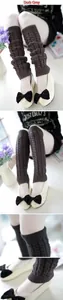 Detailed knit texture of dark grey cable knit leg warmers worn with stylish shoes