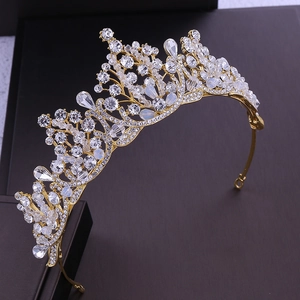 Detail of elegant gold bridal crown featuring sparkling rhinestones and crystal beads