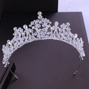 Macro detail of silver bridal crown featuring shimmering crystals and floral metalwork