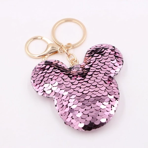 Pink sequin mouse head keychain with gold metal ring and lobster clasp on white background