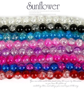 Macro detail of 8mm cracked glass round beads with colorful ice burst textures for DIY jewelry