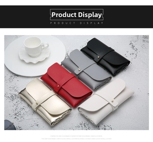 Flat lay of five faux leather sunglasses pouches in black, grey, red, gold and white