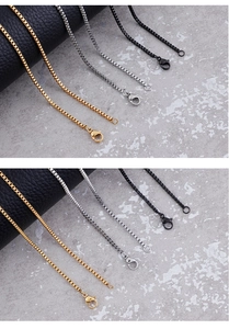 Detail of stainless steel box chains in gold, silver, and black with lobster clasps