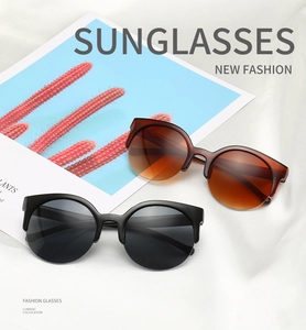 Detail of semi-rimless cat-eye sunglasses in tortoiseshell and black frame options