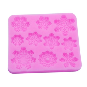 Pink snowflake silicone mold with various designs for DIY fondant cake baking and chocolate