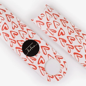 Minimalist white gift box with red heart patterns and sweet moment label for packaging