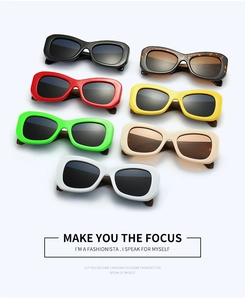 Flat lay of retro rectangle sunglasses in seven vibrant colors with thick frames