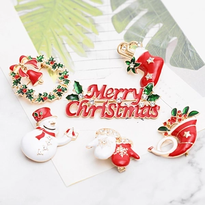 Christmas brooch set featuring enamel snowflake deer and wreath designs with rhinestones