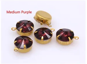 Close-up of five medium purple round glass crystal pendants with gold claw settings