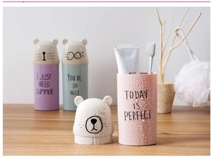 Detail of portable bear-shaped travel wash cups in pink, purple, and blue matte finish