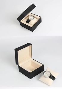 Detail view of premium matte black watch box featuring soft cream velvet interior and pillow