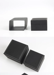 Detail showing matte black watch box with decorative white stitching and outer protective sleeve