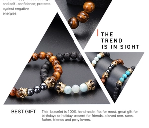 Close-up of handmade lava stone and tiger eye bracelets with zircon crown charm