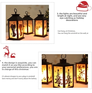 Close-up of black Christmas lantern with warm LED light and festive silhouette patterns