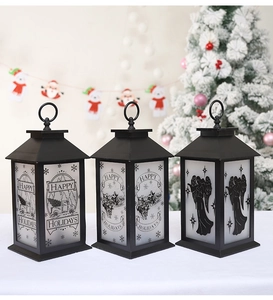 Close-up of vintage black Christmas lanterns with festive reindeer and angel motifs