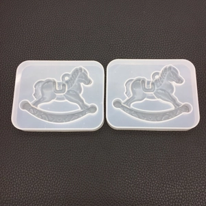 Detailed view of two rocking horse silicone molds for resin casting and DIY crafts